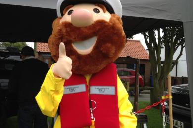 RNLI mascot Stormy Stan giving a thumbs up