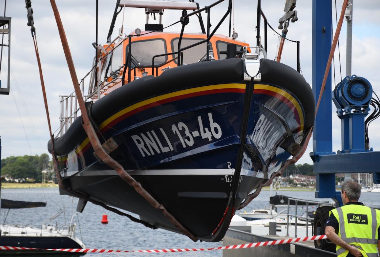 RNLB Duke of Edinburgh on a boat hoist being lowered into the water